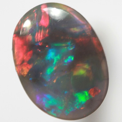 SOLID BLACK OPAL Gemmy fire of red, green and blue SEE VIDEO